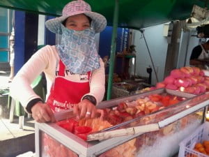 My local fruit lady, who even will tell me not to buy fruit if it isn't 'aroi' (tasty).