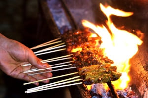 Meat on bamboo sticks, satay or sate - an easy Paleo street food. whether you dunk it in the peanut sauce is up to you and your will power...