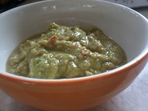 Guacamole- easy to do. I put two cloves of garlic, half an onion, one tomato, two avocados, the juice of one lime, salt pepper and a dash of cumin in the blender and gave it a whirl..